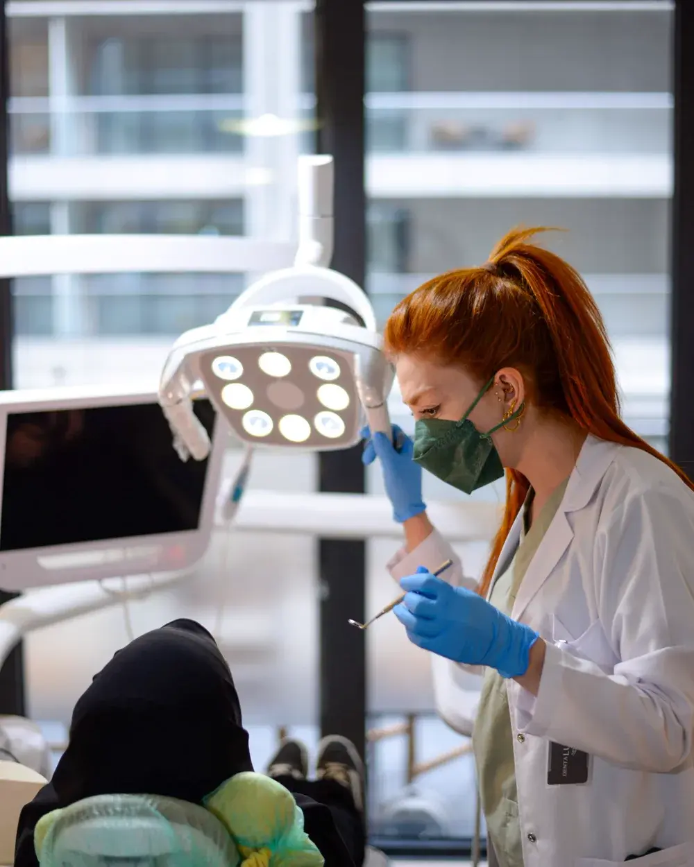 A dentist treating a patient during an emergency appointment